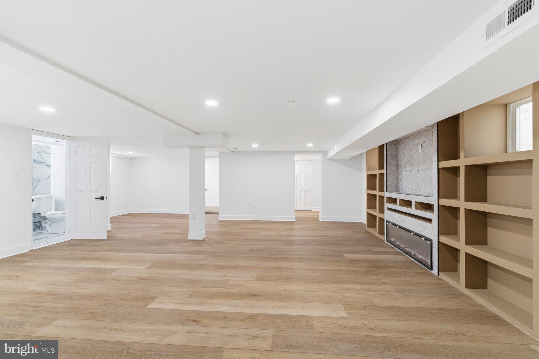 413 1st Avenue Halethorpe, MD 21227 - Photo 28 of 38 a view of an empty room with wooden floor and closet