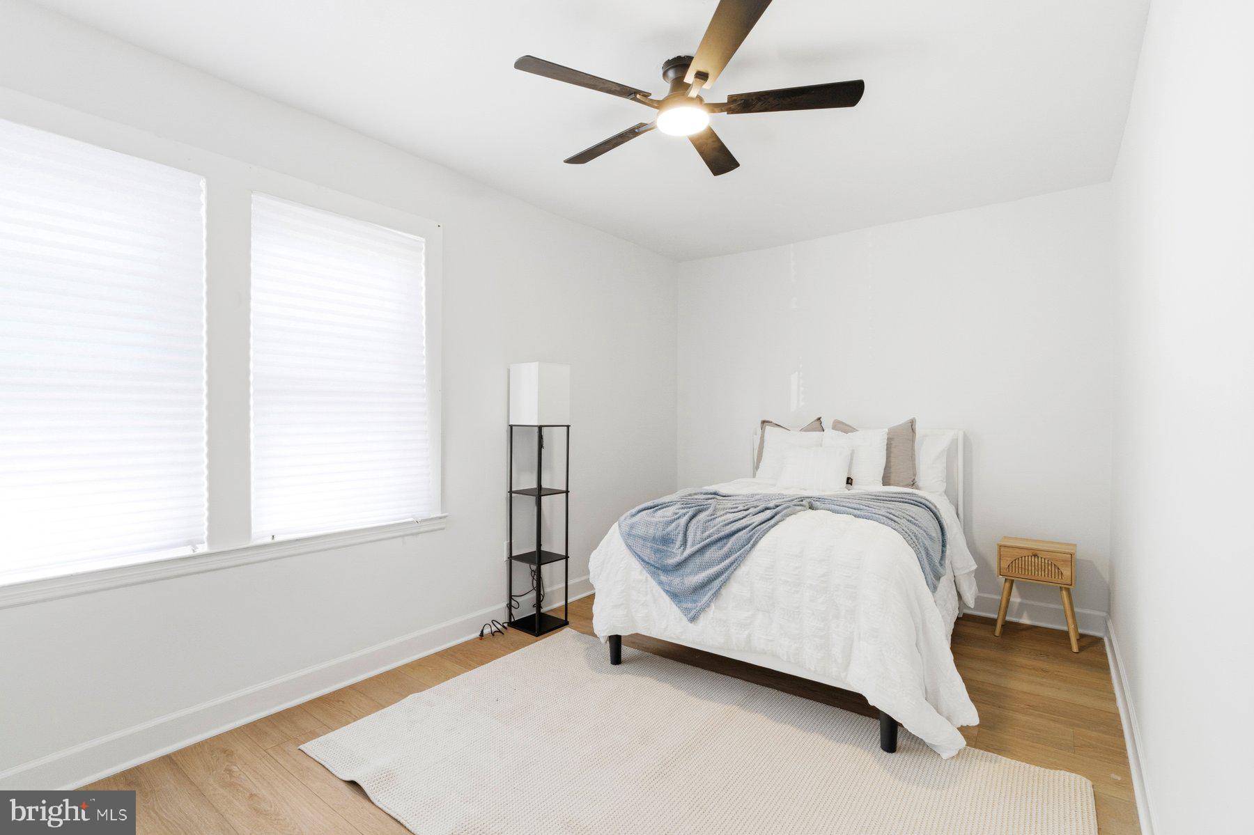 413 1st Avenue Halethorpe, MD 21227 - Photo 6 of 38 a spacious bedroom with a bed and a window