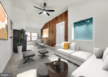 an empty room with chandelier fan