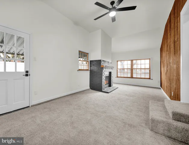 a view of empty room with windows