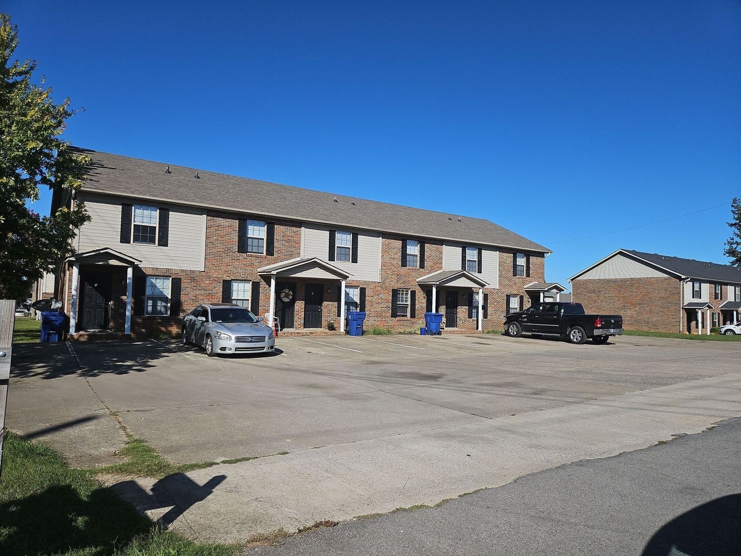 2451 Wilson Road, Unit 6 Clarksville, TN 37043 - Photo 1 of 14 a front view of a house with cars parked in front of house