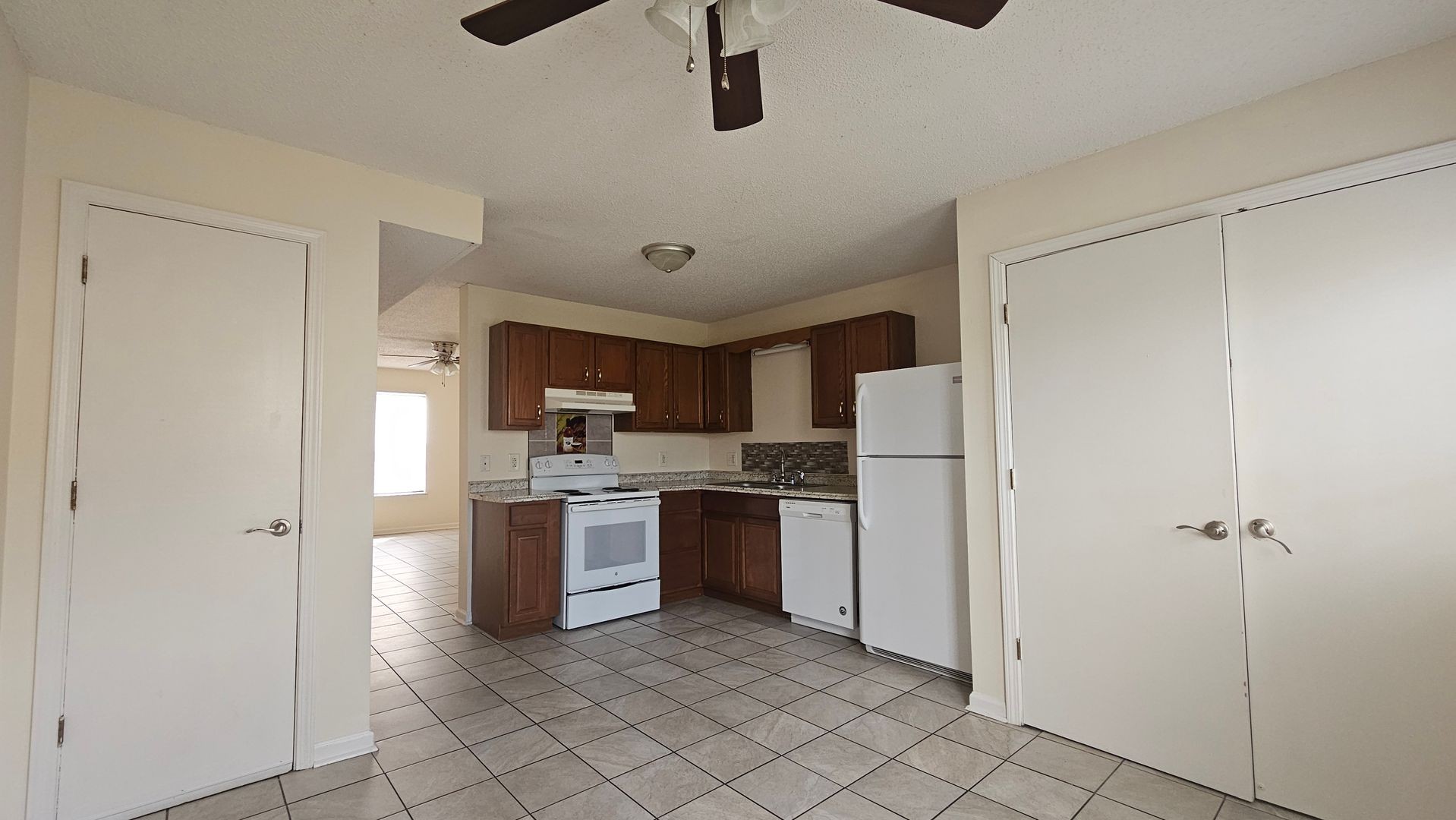 2451 Wilson Road, Unit 6 Clarksville, TN 37043 - Photo 5 of 14 a kitchen with stainless steel appliances granite countertop white cabinets and refrigerator