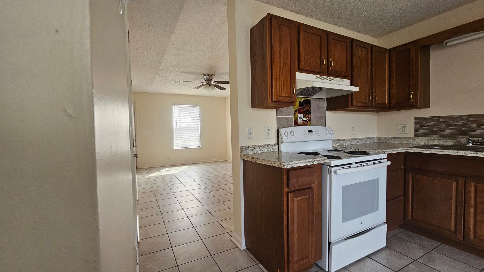 2451 Wilson Road, Unit 6 Clarksville, TN 37043 - Photo 6 of 14 a kitchen with a stove a sink and a refrigerator