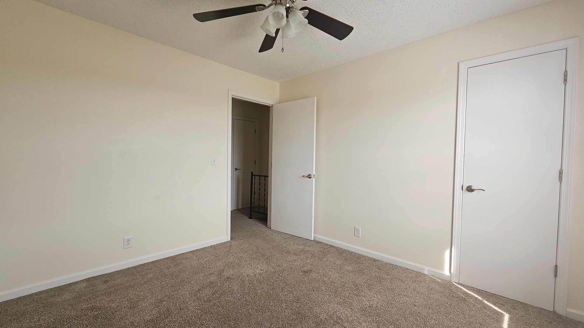 2451 Wilson Road, Unit 6 Clarksville, TN 37043 - Photo 7 of 14 an empty room with a ceiling fan and carpet