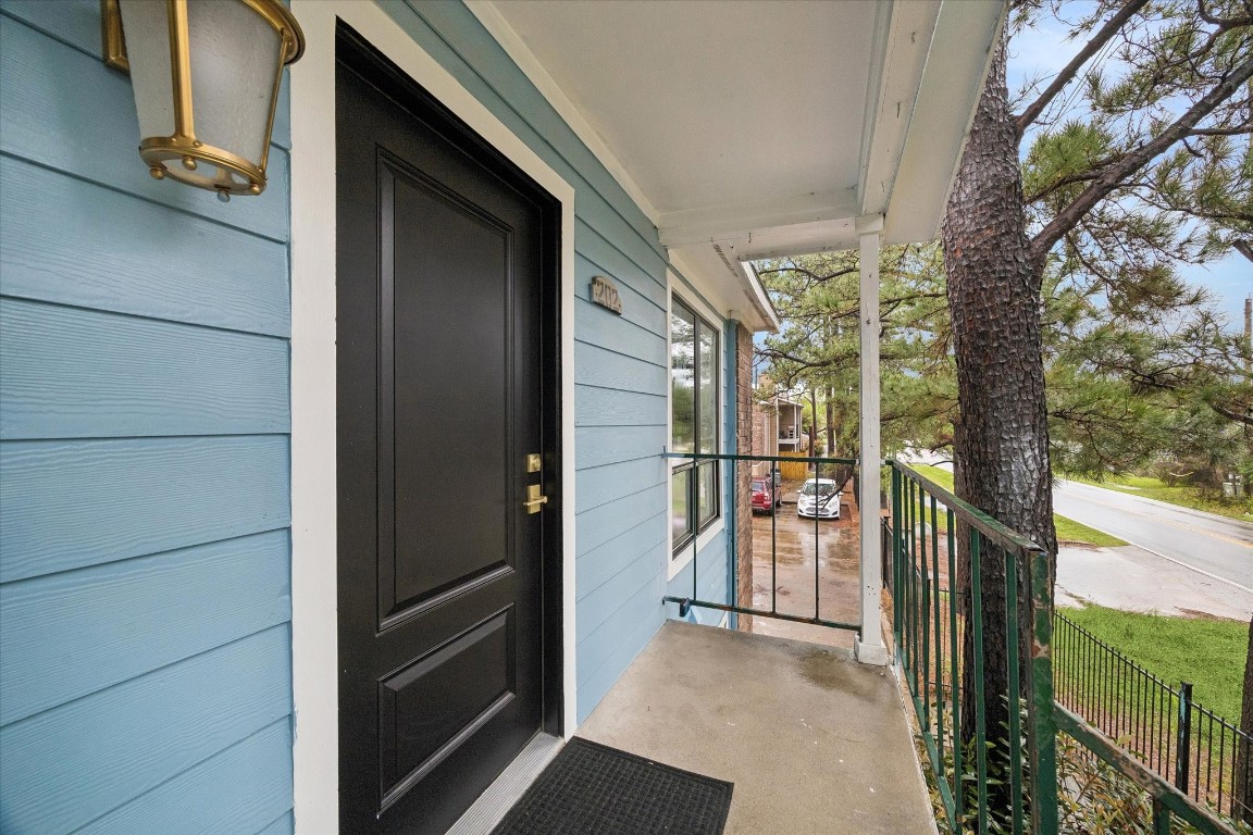 7402 Alabonson Road, Unit 202 Houston, TX 77088 - Photo 5 of 10 a view of a porch
