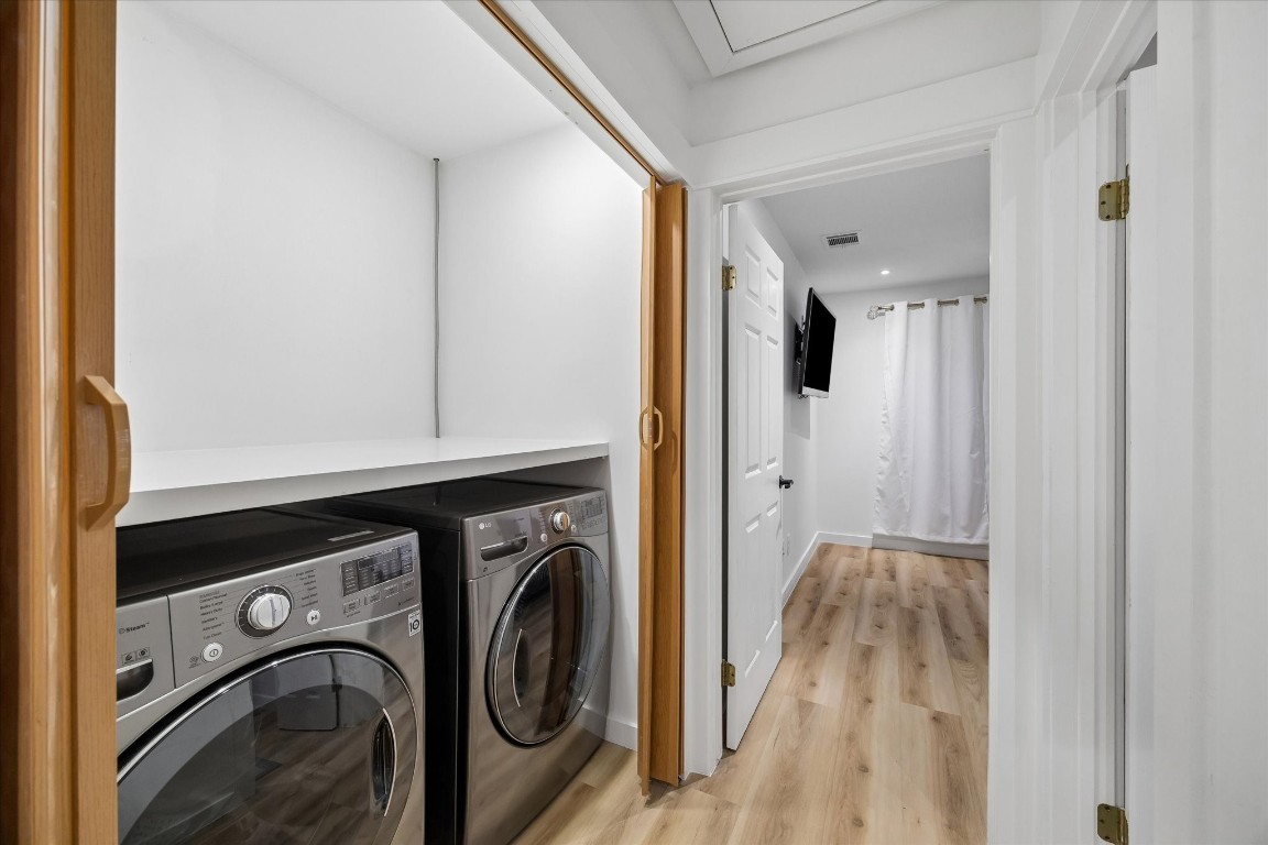 7402 Alabonson Road, Unit 202 Houston, TX 77088 - Photo 9 of 10 a utility room with dryer and washer