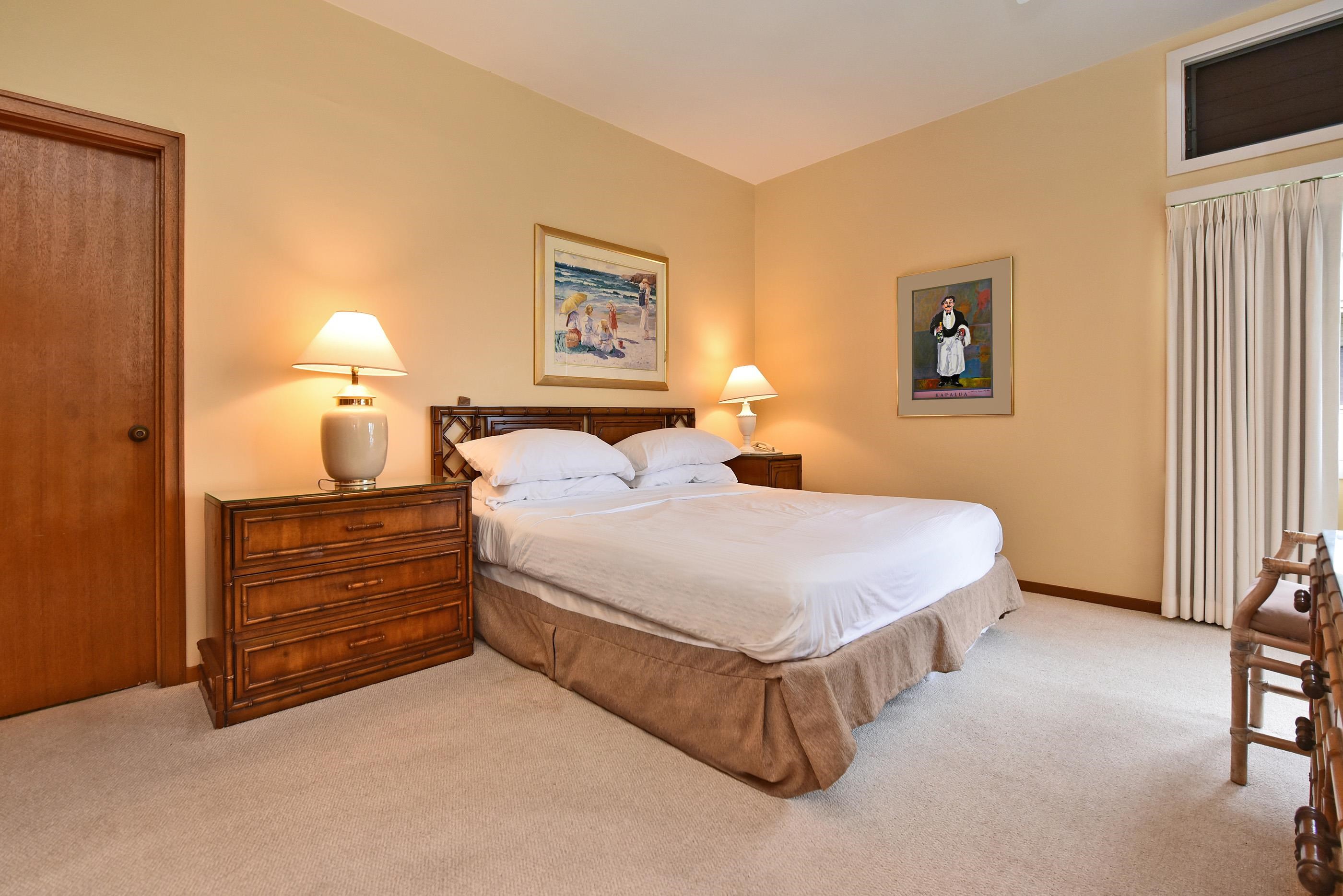 100 Ridge Road, Unit 161113 Lahaina, HI 96761 - Photo 12 of 30 a bedroom with a bed and a night stand