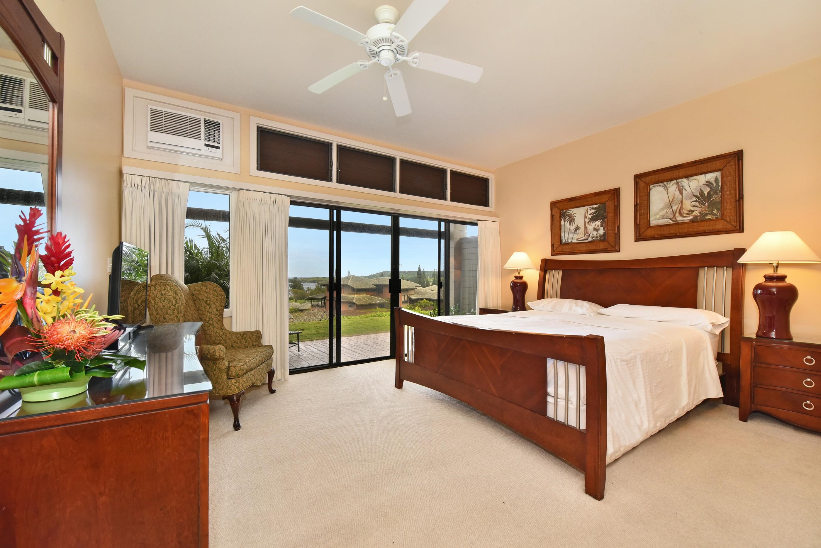 100 Ridge Road, Unit 161113 Lahaina, HI 96761 - Photo 25 of 30 a bed room with a bed and a chair