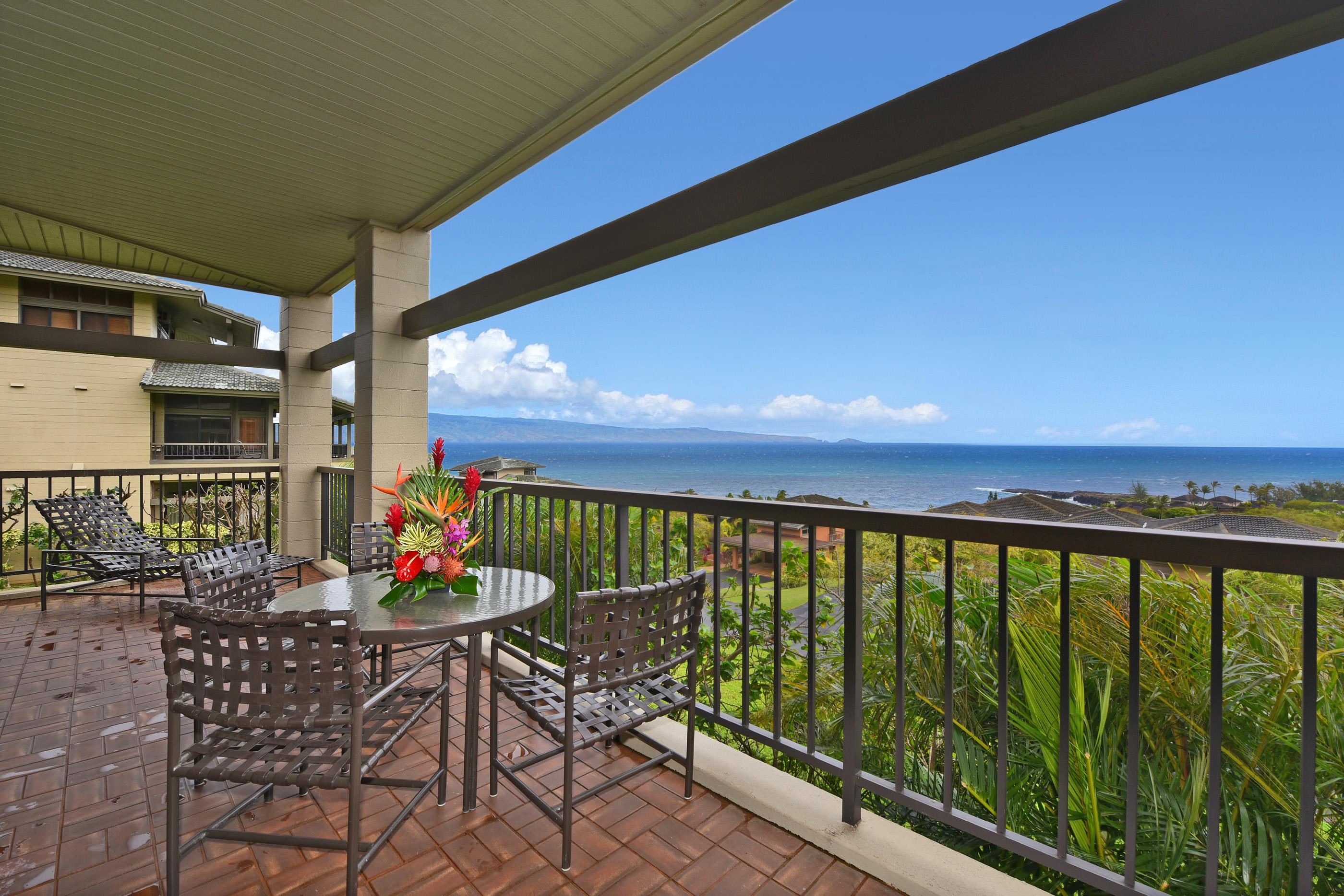 100 Ridge Road, Unit 161113 Lahaina, HI 96761 - Photo 3 of 30 a view of a balcony with chairs and wooden floor