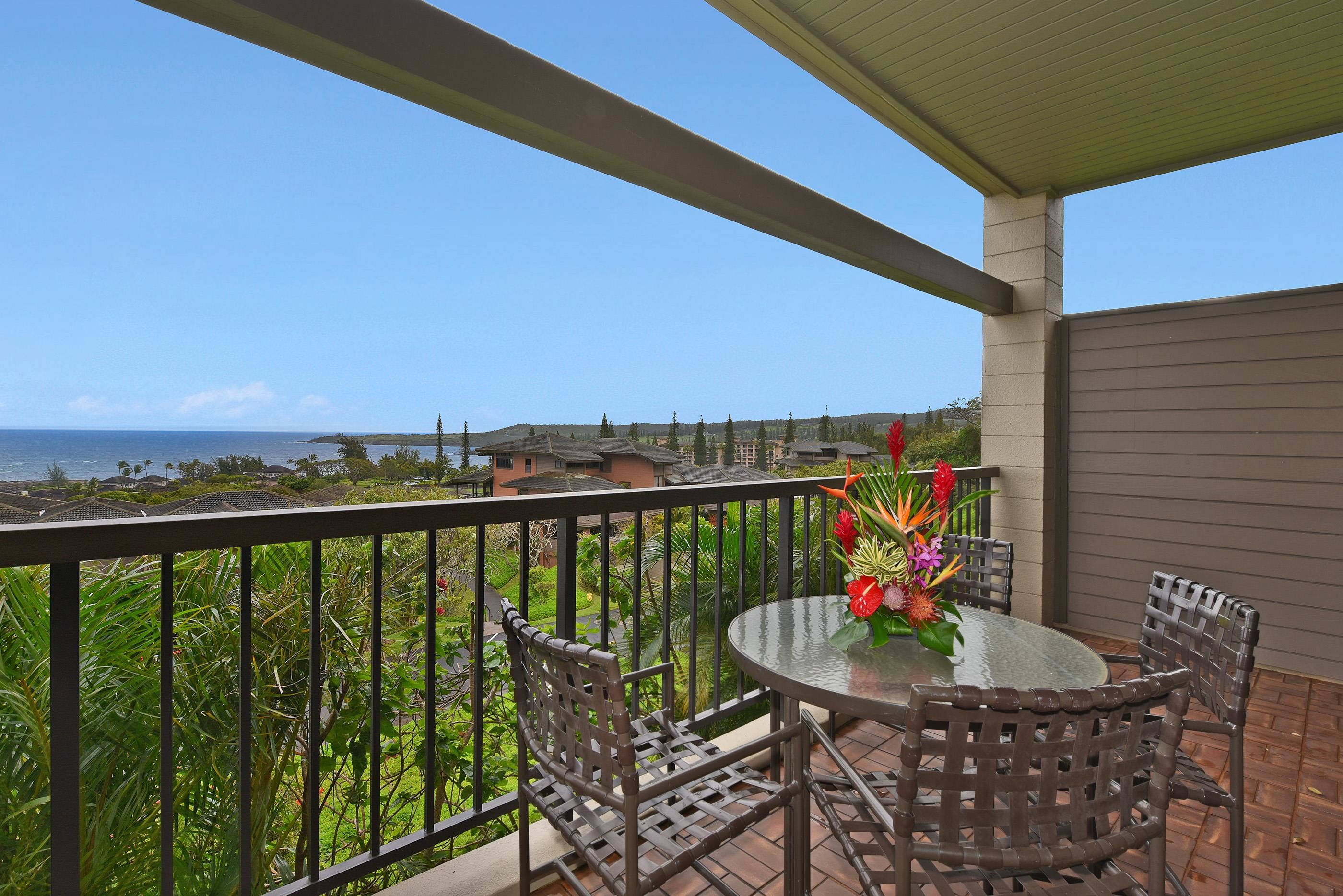 100 Ridge Road, Unit 161113 Lahaina, HI 96761 - Photo 4 of 30 a view of a balcony with a table and chairs