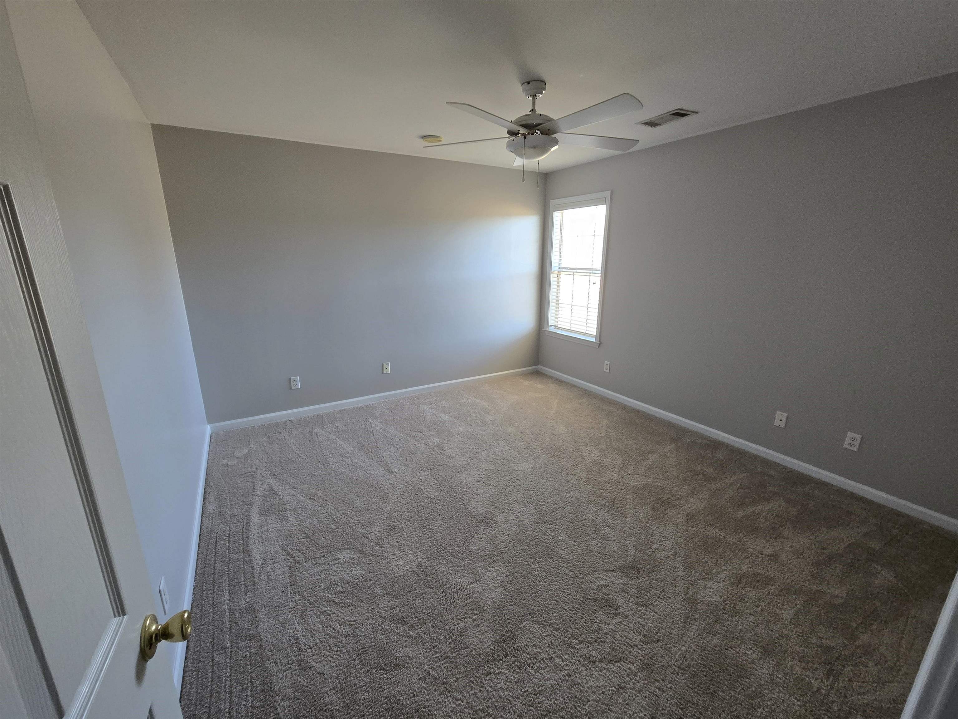 10448 Sunnybrook Circle Collierville, TN 38017 - Photo 13 of 22 wooden floor in an empty room with a window