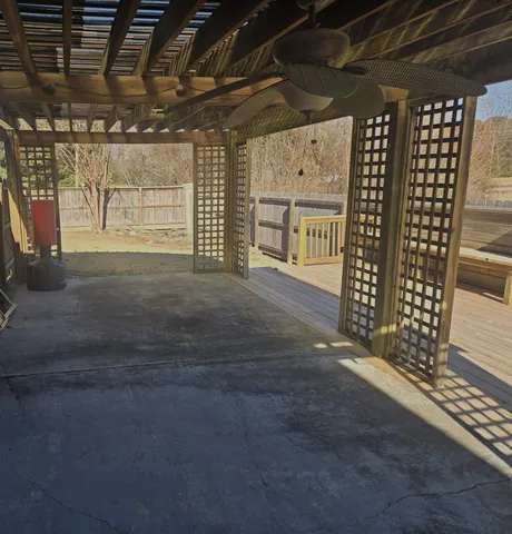 a view of an empty room with wooden roof