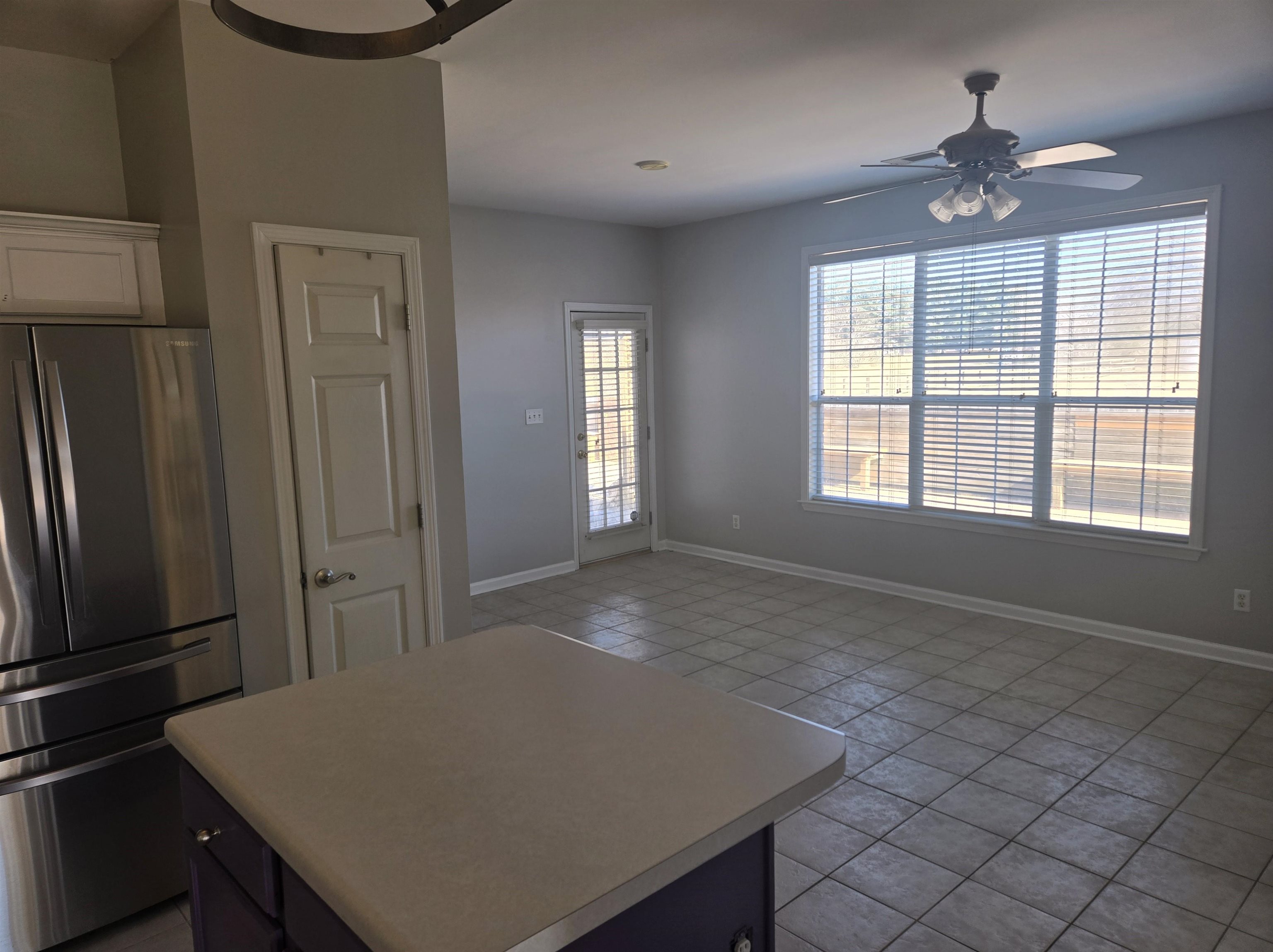 10448 Sunnybrook Circle Collierville, TN 38017 - Photo 6 of 22 a view of a kitchen with a stove fridge and wooden floor