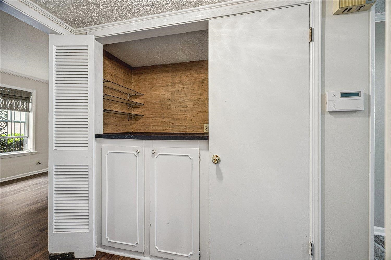 865 South Yates Road, Unit 1 Memphis, TN 38120 - Photo 17 of 25 Detailed view of wood finished floors and a textured ceiling