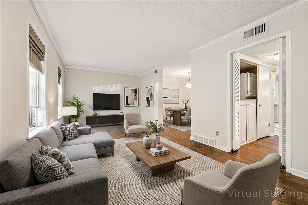 865 South Yates Road, Unit 1 Memphis, TN 38120 - Photo 2 of 25 Living room with crown molding, wood finished floors, and a textured ceiling