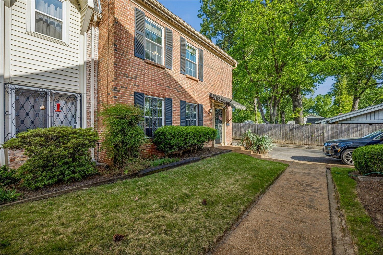 865 South Yates Road, Unit 1 Memphis, TN 38120 - Photo 25 of 25 View of front of property featuring brick siding