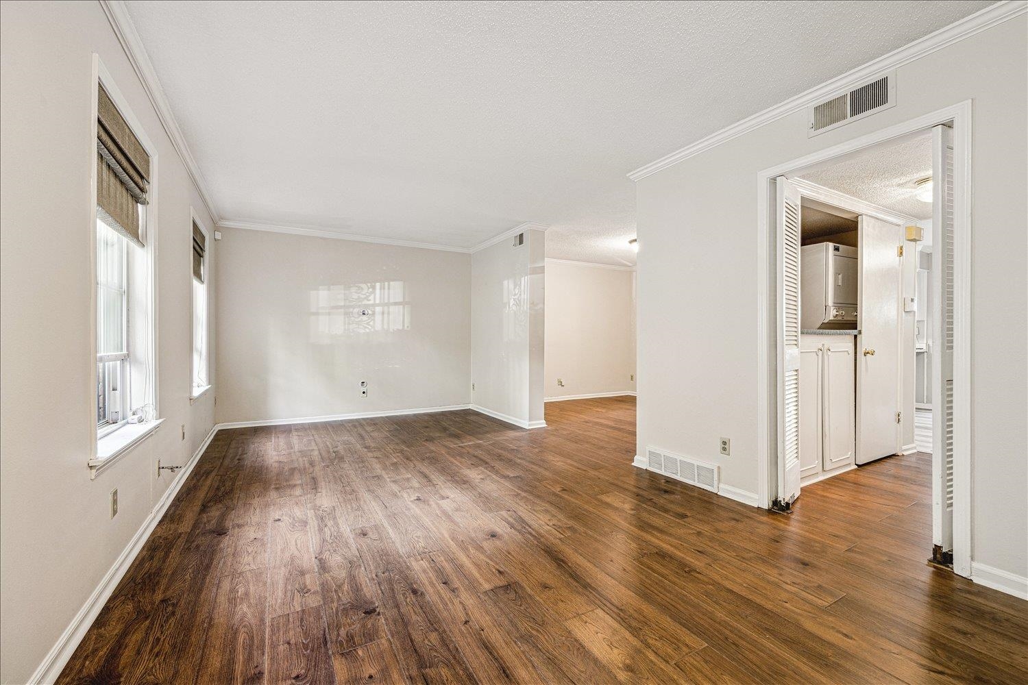865 South Yates Road, Unit 1 Memphis, TN 38120 - Photo 3 of 25 Unfurnished room with ornamental molding and dark wood-style floors