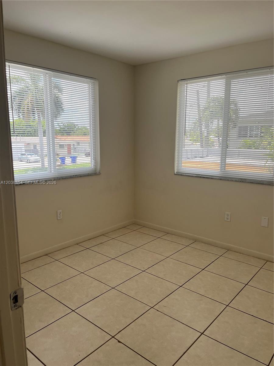 1419 Southwest 22nd Avenue Miami, FL 33145 - Photo 13 of 20 a view of empty room with window