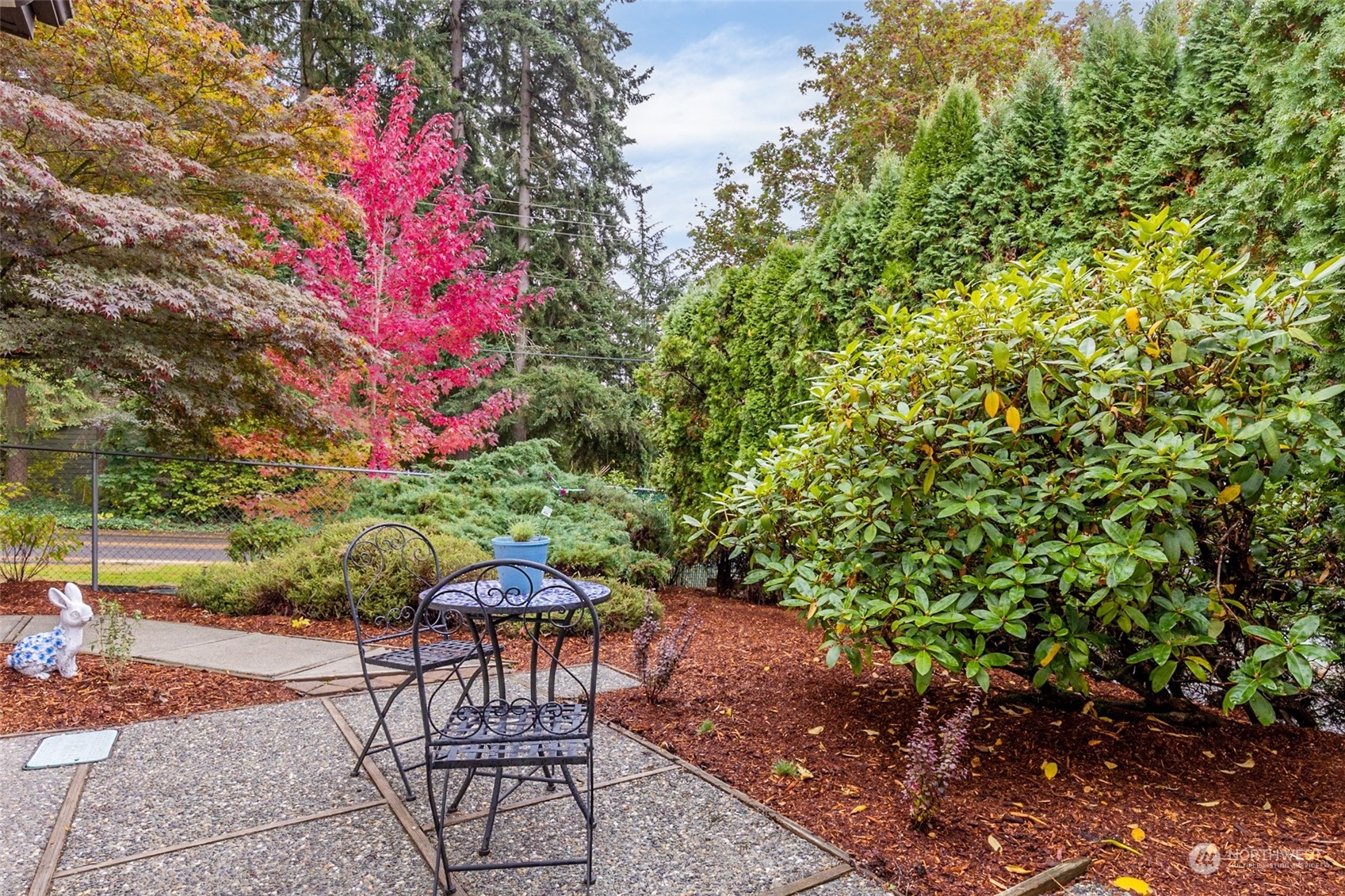 722 Wandering Creek Drive Bothell, WA 98021 - Photo 25 of 31 a patio with table and chairs and potted plants