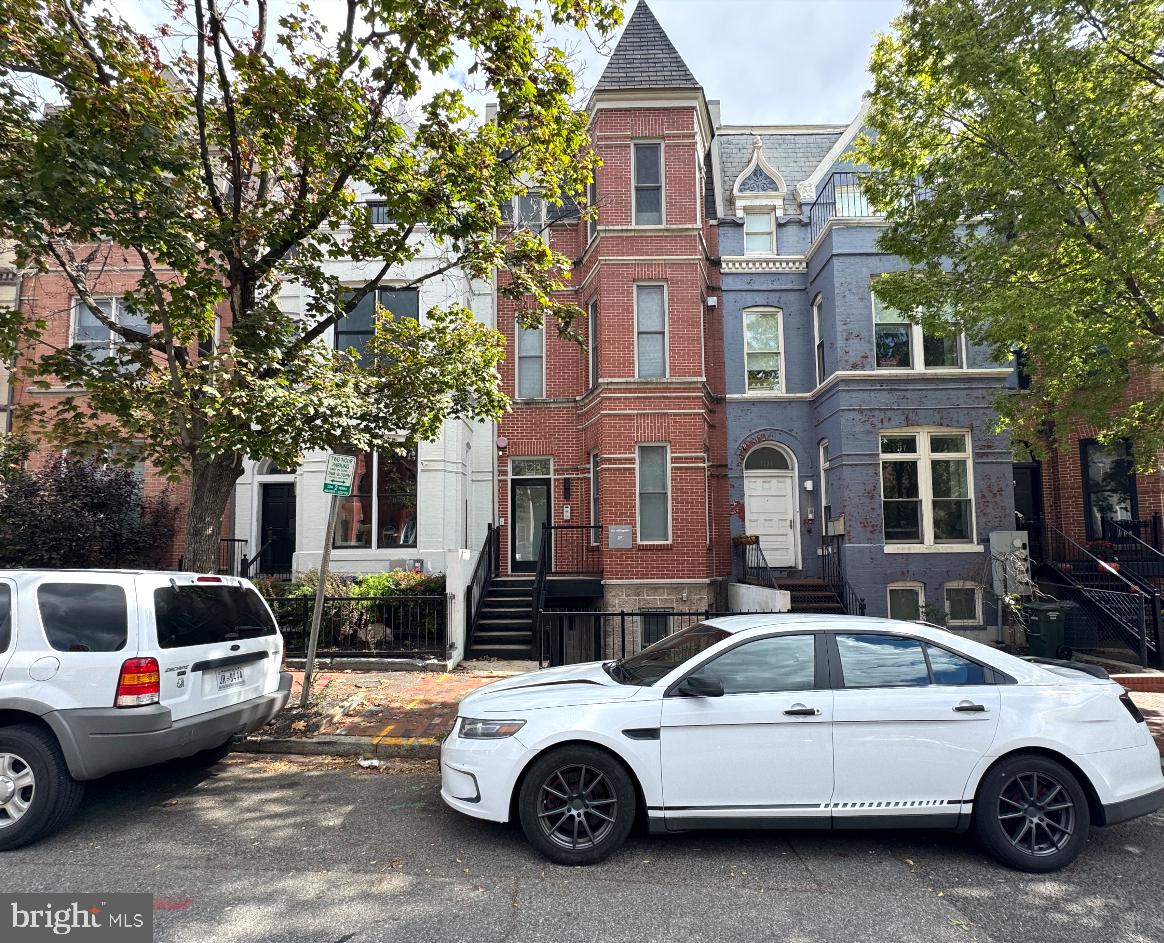 1123 6th Street Northwest, Unit 1 Washington, DC 20001 - Photo 1 of 19 a car parked in front of a house