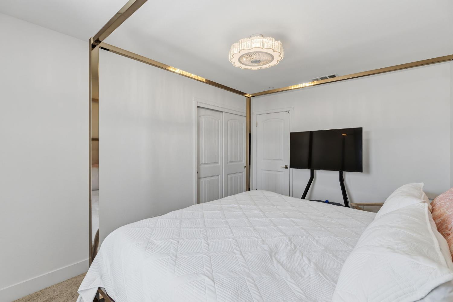 6326 West Richert Avenue Fresno, CA 93723 - Photo 29 of 45 a bedroom with a bed and a lamp