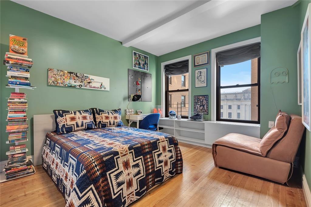 135 Eastern Parkway, Unit 7E Brooklyn, NY 11238 - Photo 11 of 17 a bedroom with a large bed couch and two large window