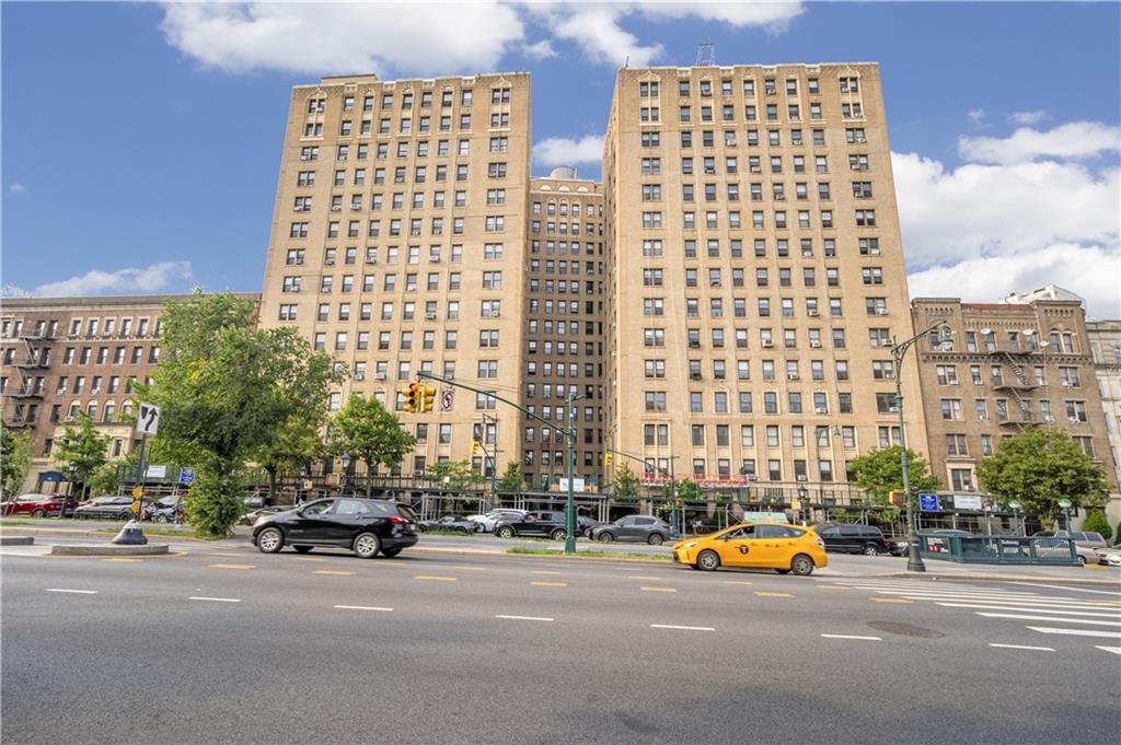 135 Eastern Parkway, Unit 7E Brooklyn, NY 11238 - Photo 14 of 17 a city street filled with lots of tall buildings