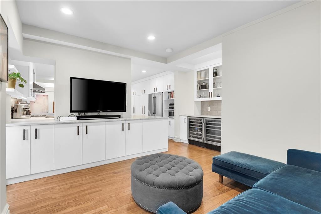135 Eastern Parkway, Unit 7E Brooklyn, NY 11238 - Photo 4 of 17 a living room with furniture and a flat screen tv