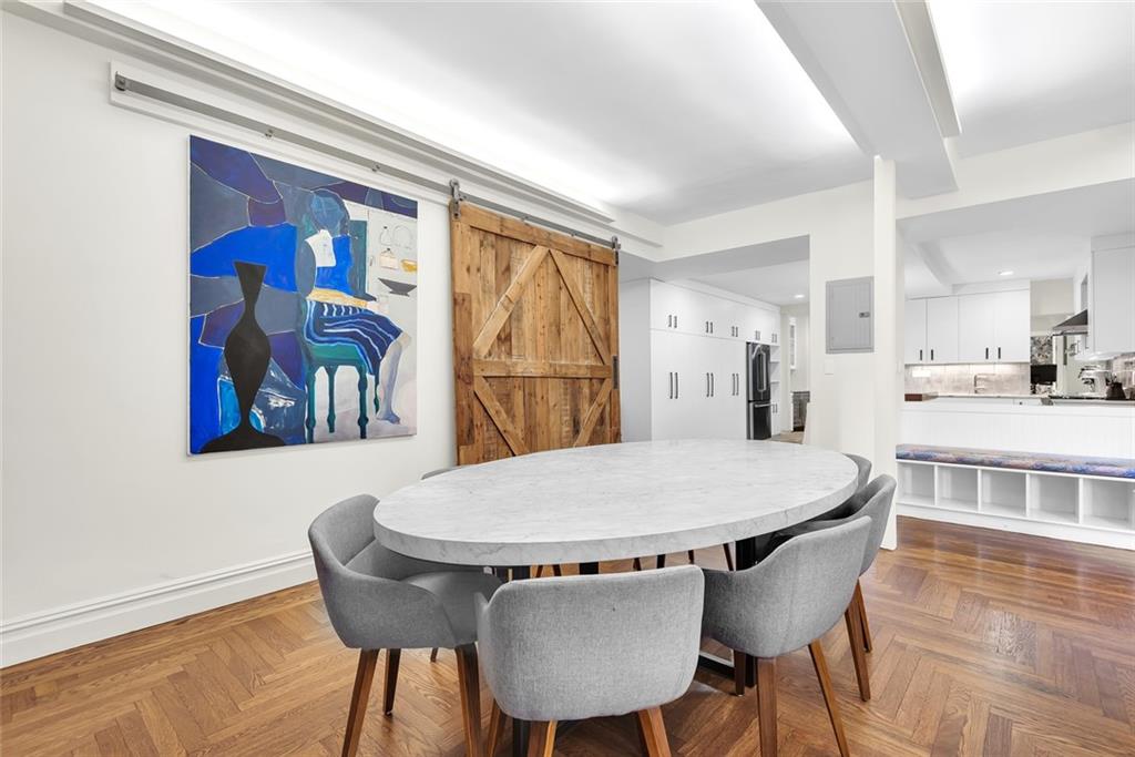 135 Eastern Parkway, Unit 7E Brooklyn, NY 11238 - Photo 5 of 17 a view of a dining room with furniture window and wooden floor