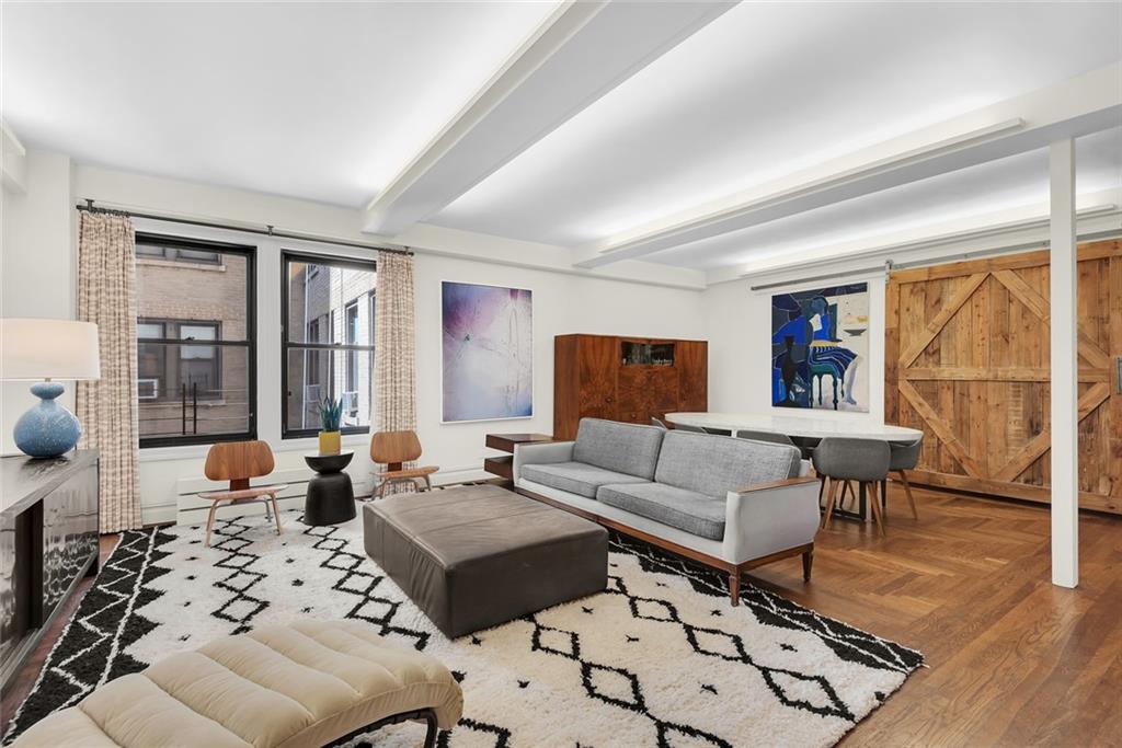 135 Eastern Parkway, Unit 7E Brooklyn, NY 11238 - Photo 7 of 17 a living room with furniture and a large window