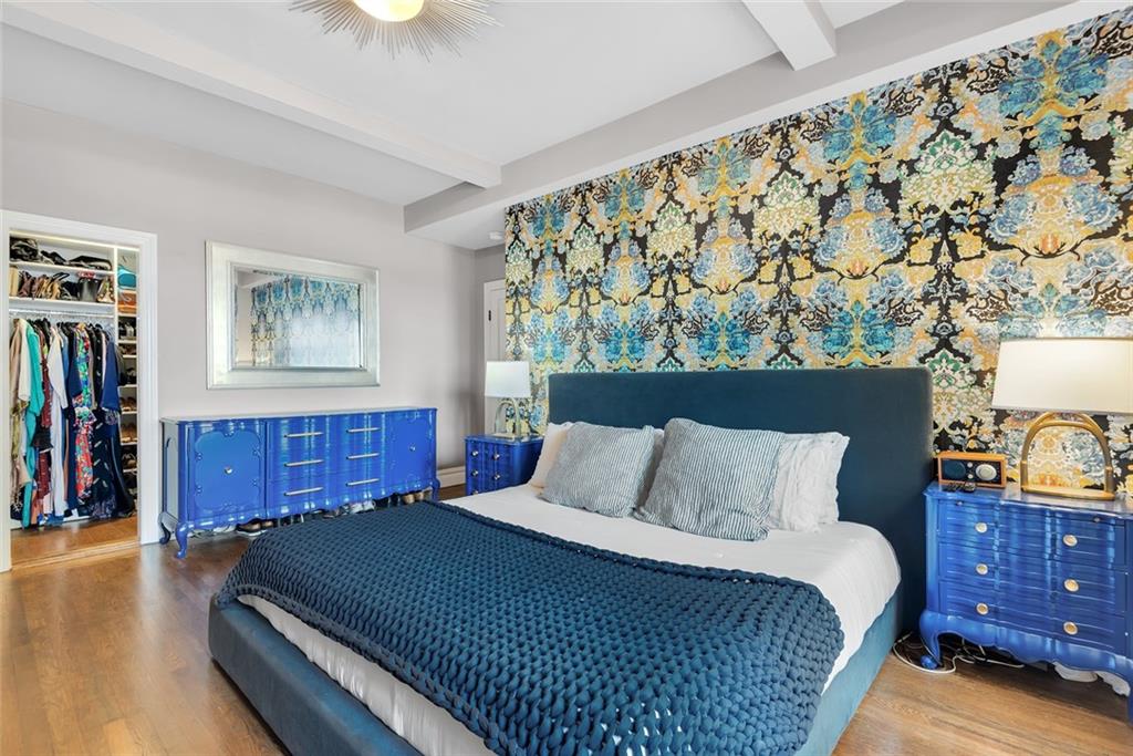 135 Eastern Parkway, Unit 7E Brooklyn, NY 11238 - Photo 8 of 17 a bedroom with a bed and a night stand