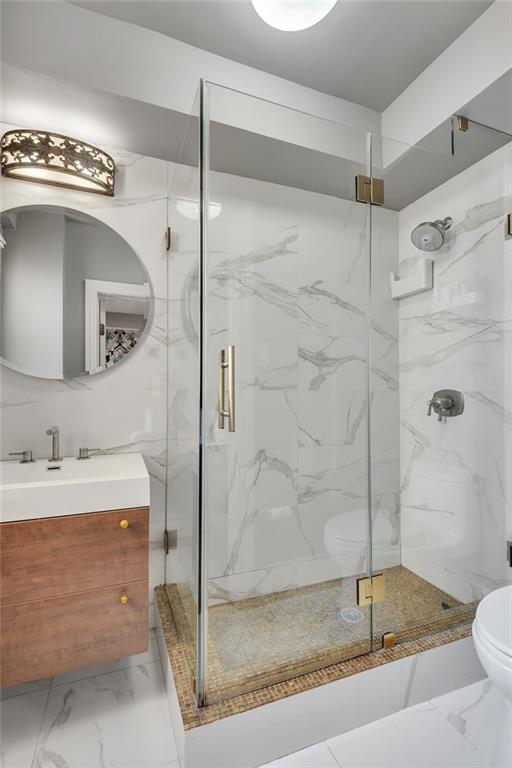 135 Eastern Parkway, Unit 7E Brooklyn, NY 11238 - Photo 9 of 17 a bathroom with a granite countertop sink mirror and shower