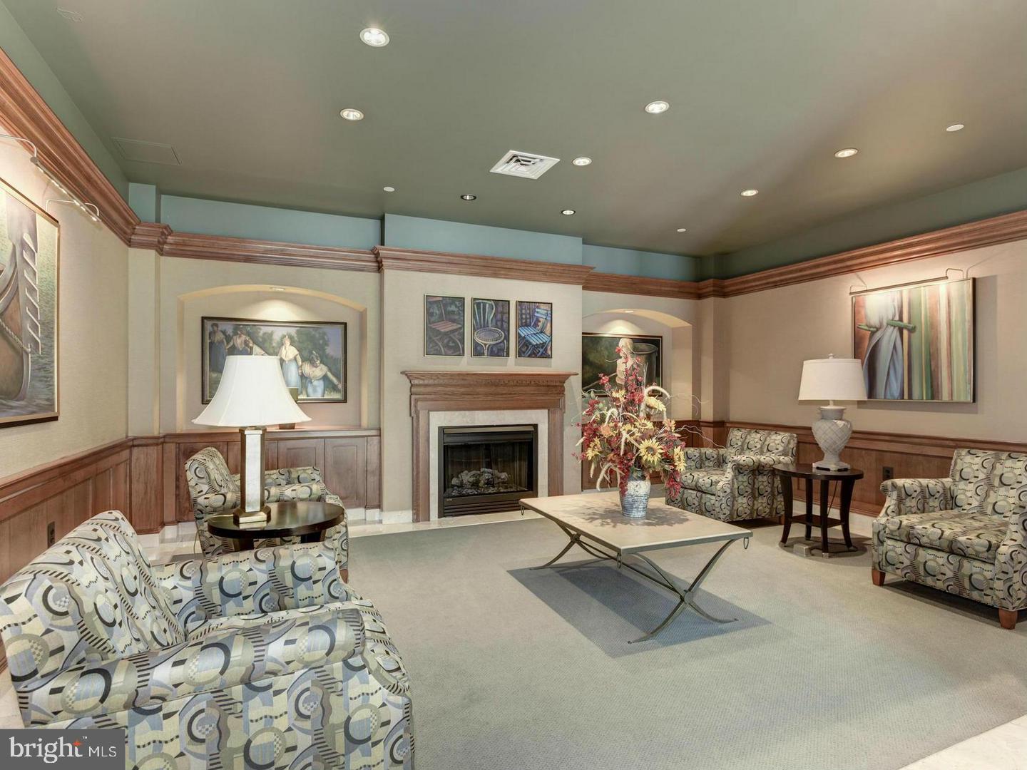 11800 Sunset Hills Road, Unit 314 Reston, VA 20190 - Photo 32 of 50 a living room with furniture and a fireplace