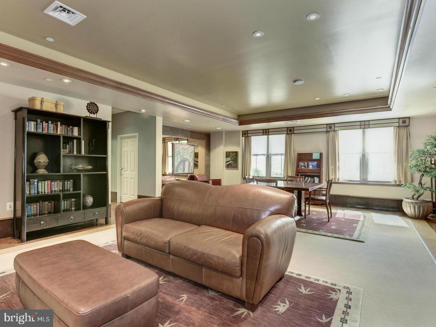 11800 Sunset Hills Road, Unit 314 Reston, VA 20190 - Photo 34 of 50 a living room with furniture and a window