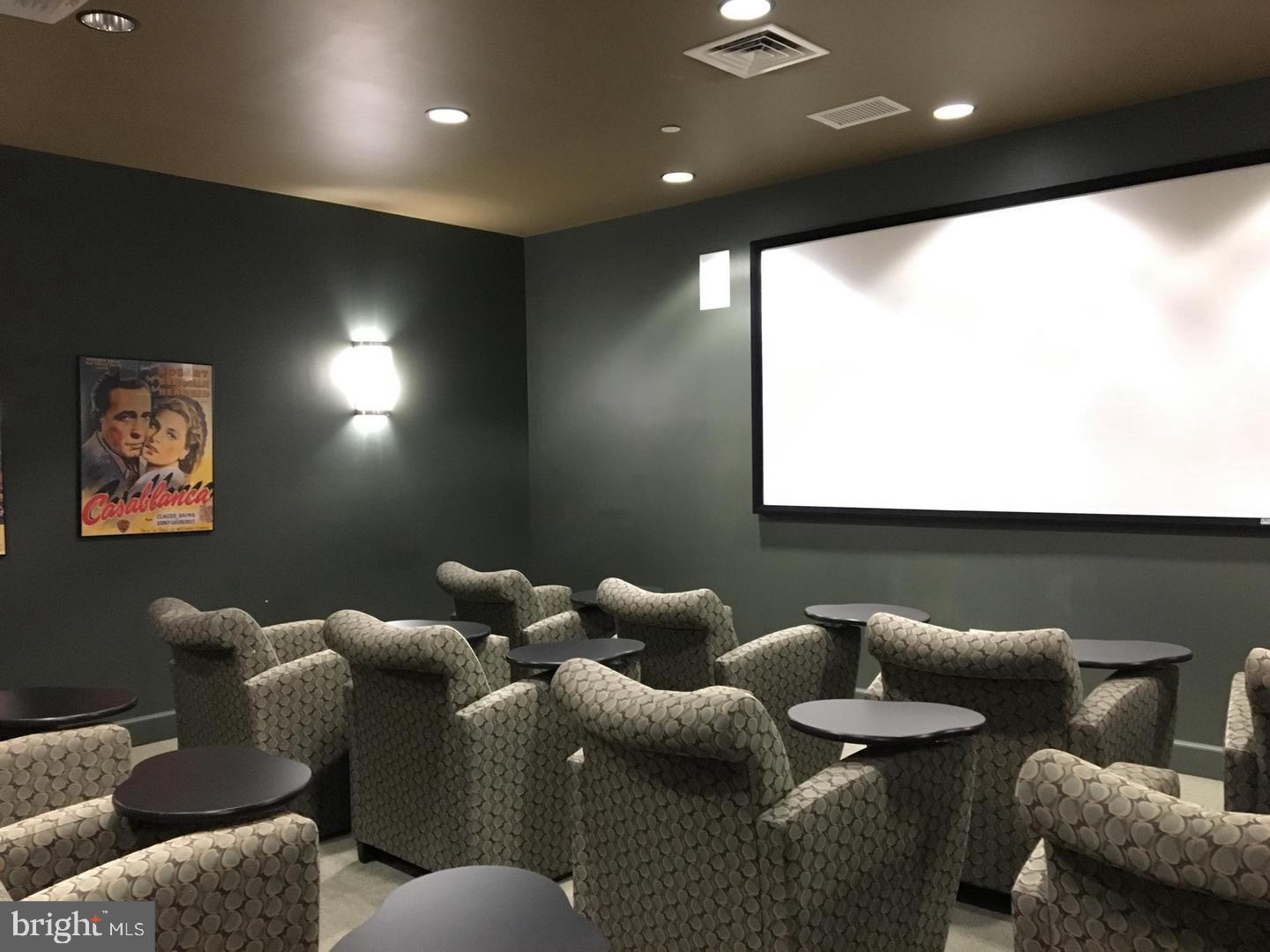 11800 Sunset Hills Road, Unit 314 Reston, VA 20190 - Photo 40 of 50 a media room with lots of chairs and a projector screen