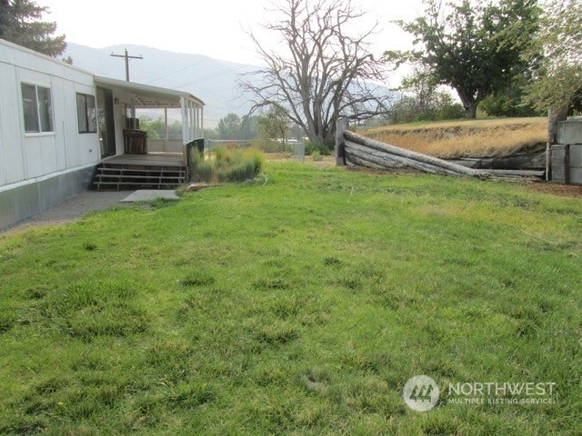 309 North Main Street Riverside, WA 98849 - Photo 19 of 31 a view of a house with backyard and a tree