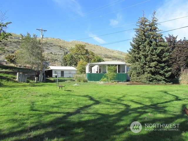 309 North Main Street Riverside, WA 98849 - Photo 21 of 31 a front view of a house with a garden