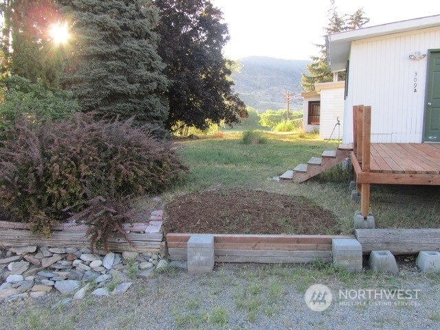309 North Main Street Riverside, WA 98849 - Photo 23 of 31 a backyard of a house with outdoor seating
