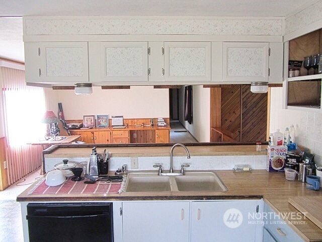 309 North Main Street Riverside, WA 98849 - Photo 6 of 31 a kitchen with kitchen island granite countertop a sink and cabinets