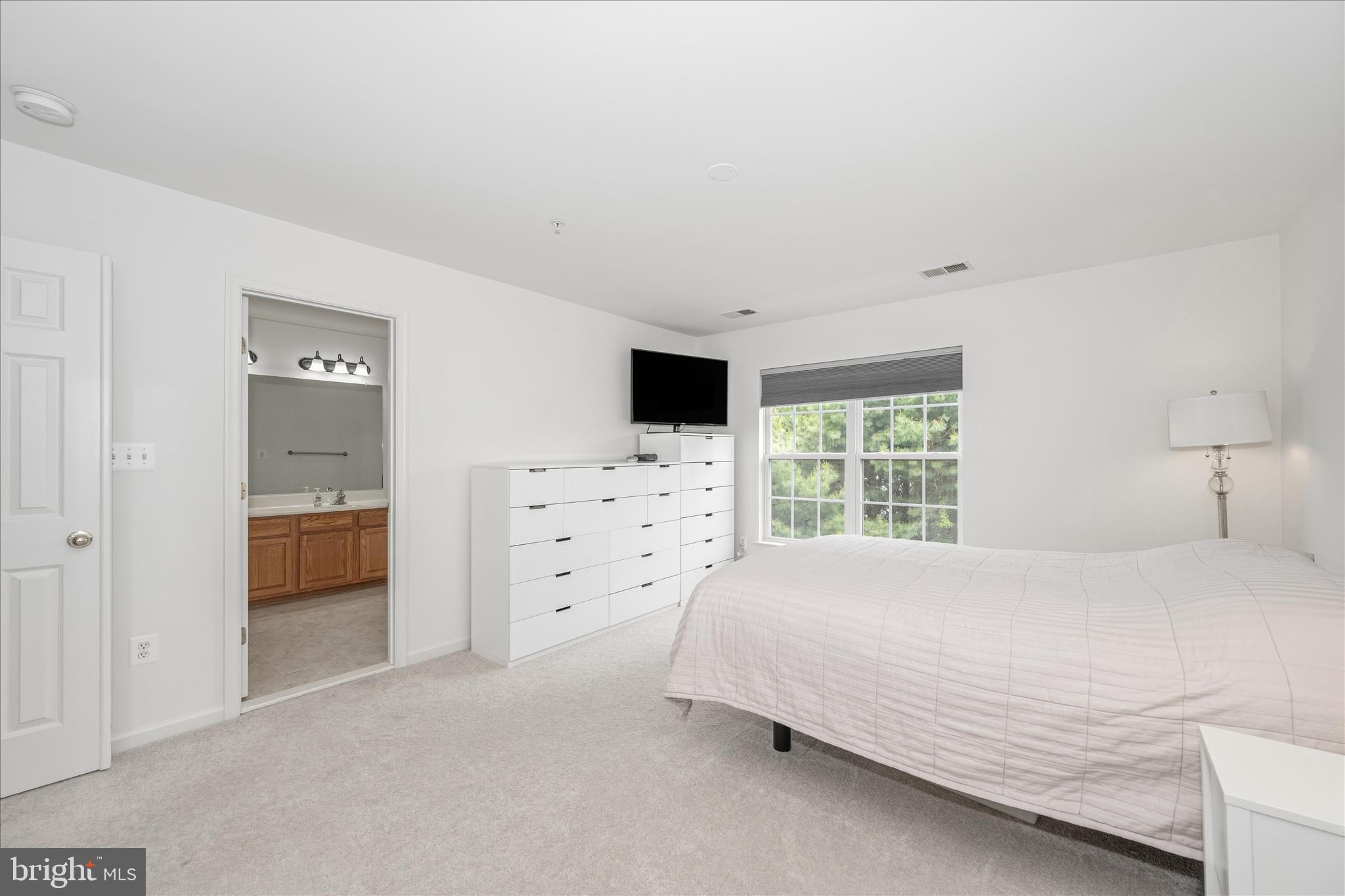 21 Inkberry Circle Gaithersburg, MD 20877 - Photo 29 of 51 a bedroom with a bed and a tv