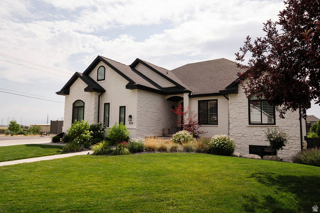 924 Country Lane Farmington, UT 84025 - Photo 4 of 91 Contemporary residence featuring a white stone and stucco exterior with dark trim