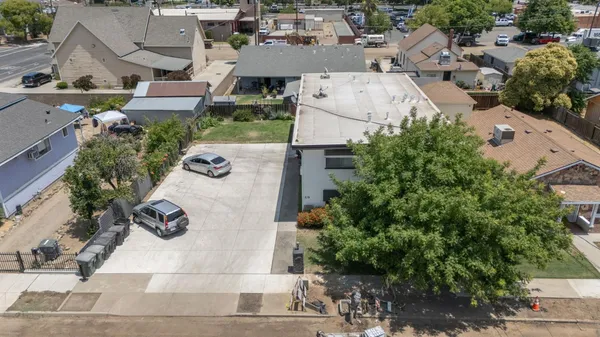 an aerial view of residential houses with outdoor space
