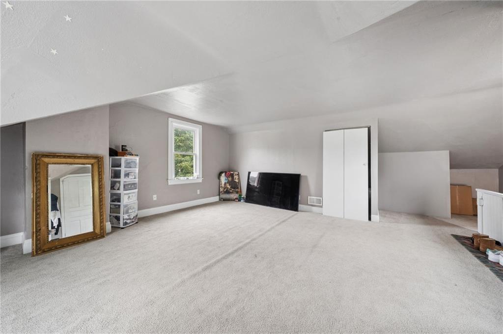 1523 Evergreen Road Pittsburgh, PA 15209 - Photo 28 of 35 a view of an empty room with a fireplace and a window