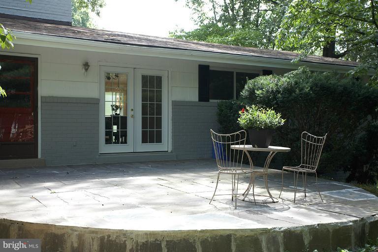 11204 Monticello Avenue Silver Spring, MD 20902 - Photo 1 of 29 a patio with table and chairs and potted plants