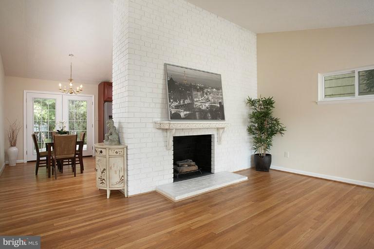 11204 Monticello Avenue Silver Spring, MD 20902 - Photo 13 of 29 a living room with furniture and a fireplace