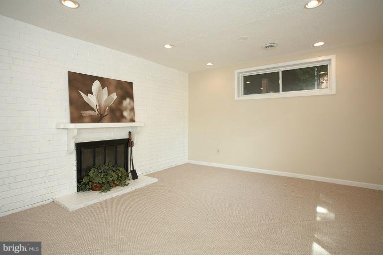 11204 Monticello Avenue Silver Spring, MD 20902 - Photo 17 of 29 an empty room with a fireplace