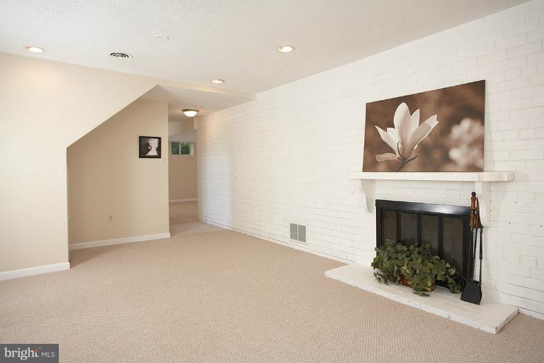 11204 Monticello Avenue Silver Spring, MD 20902 - Photo 21 of 29 a view of an empty room with a fireplace