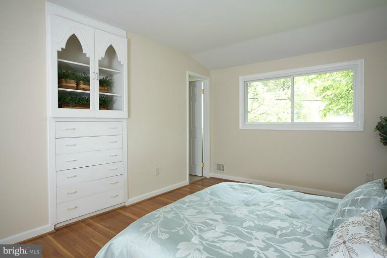 11204 Monticello Avenue Silver Spring, MD 20902 - Photo 4 of 29 a bedroom with a bed and a window
