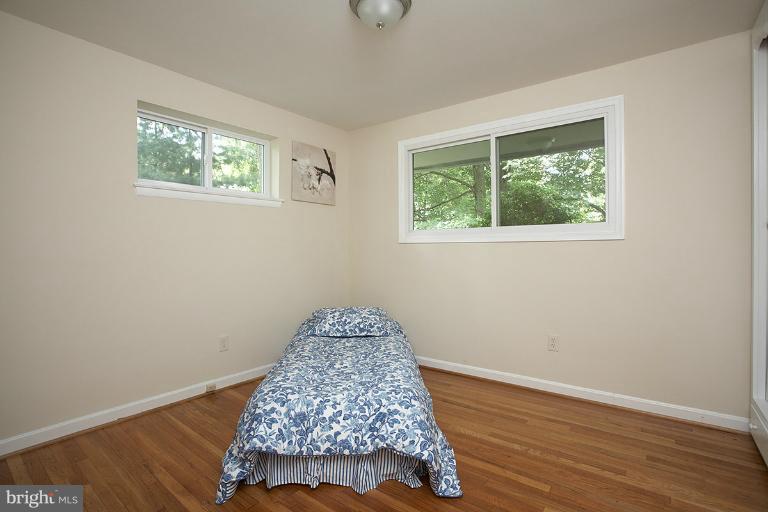 11204 Monticello Avenue Silver Spring, MD 20902 - Photo 5 of 29 a view of room with window and wooden floor