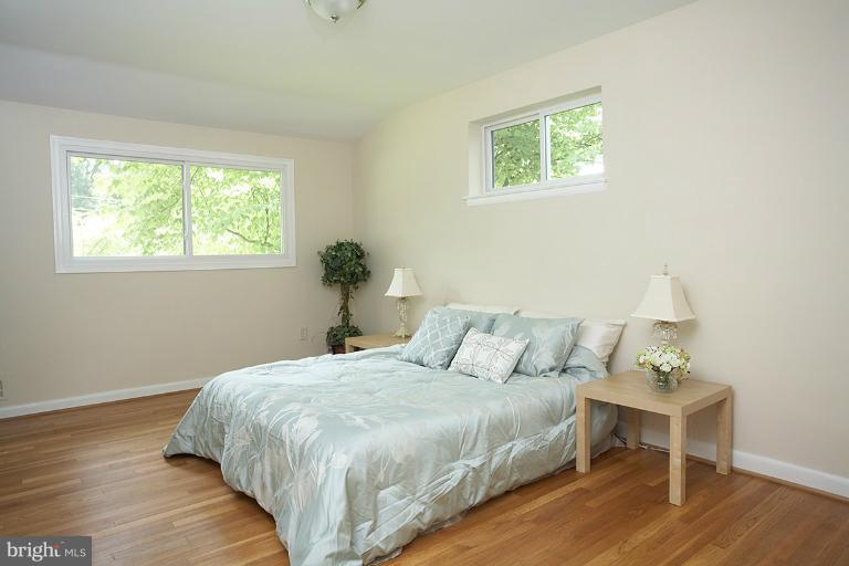 11204 Monticello Avenue Silver Spring, MD 20902 - Photo 7 of 29 a bedroom with a bed and window